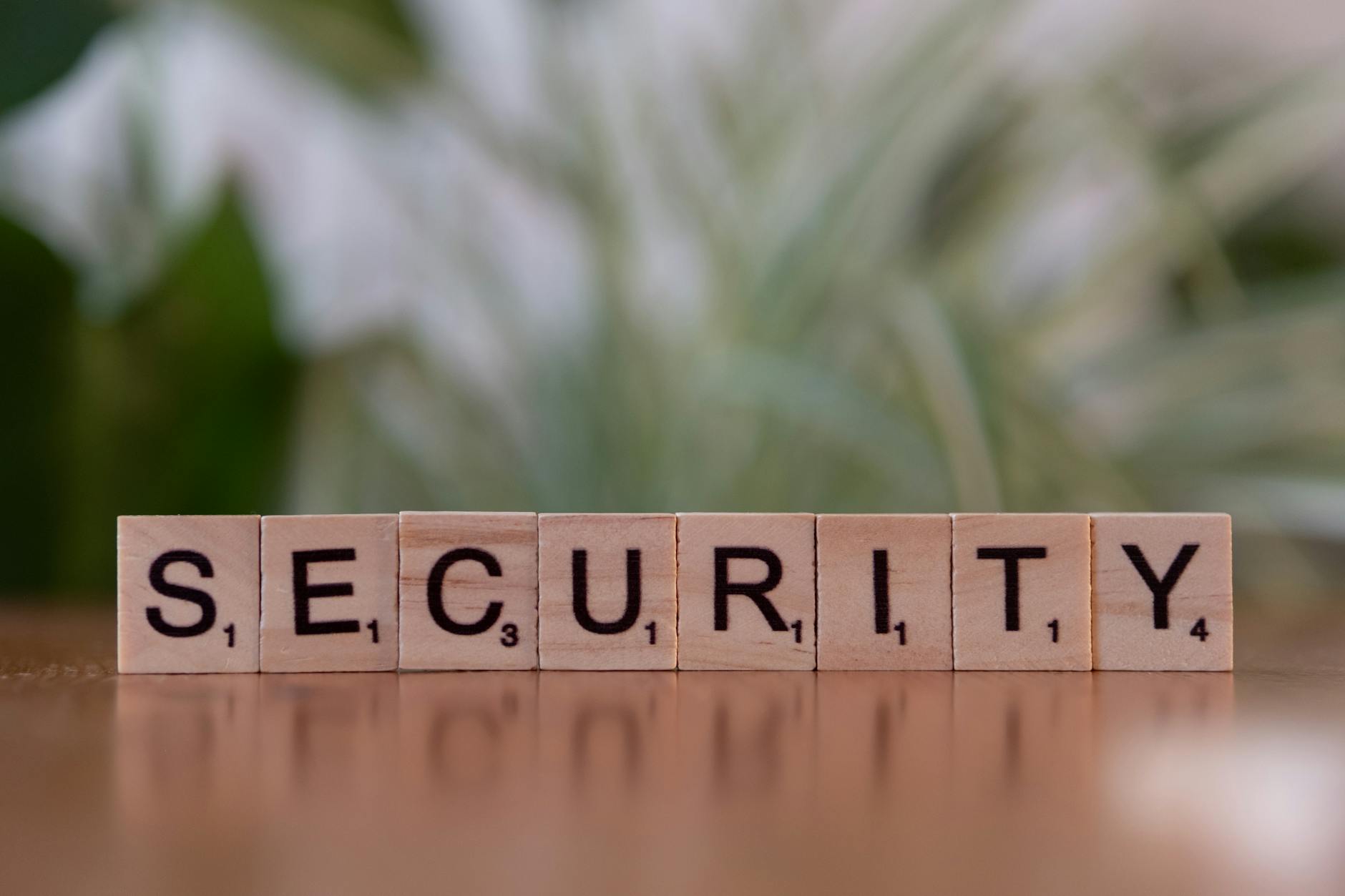 scrabble tiles spelling the word security