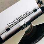 white vintage typewriter with paper