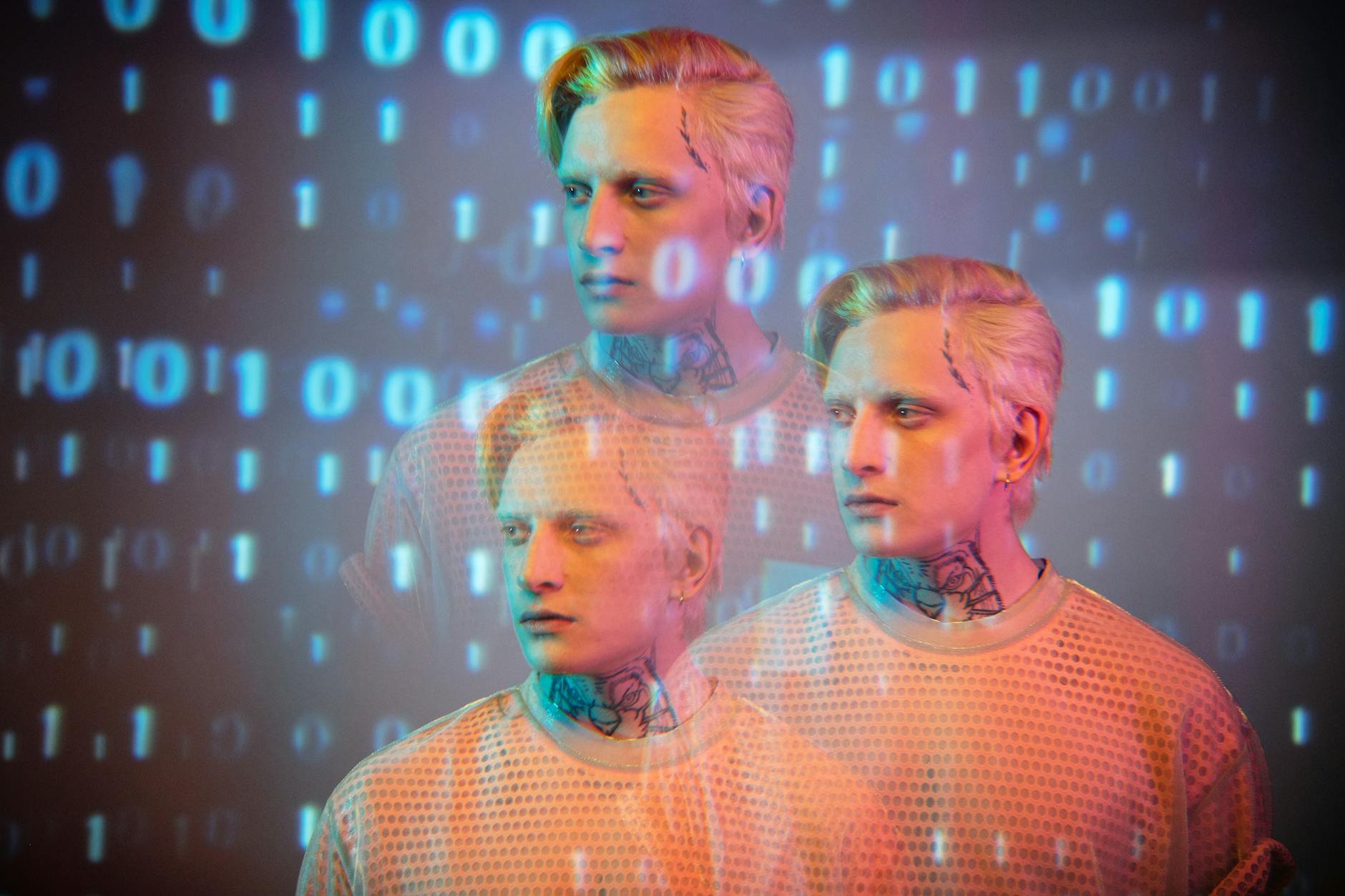 blonde model with tattoos wearing sweater